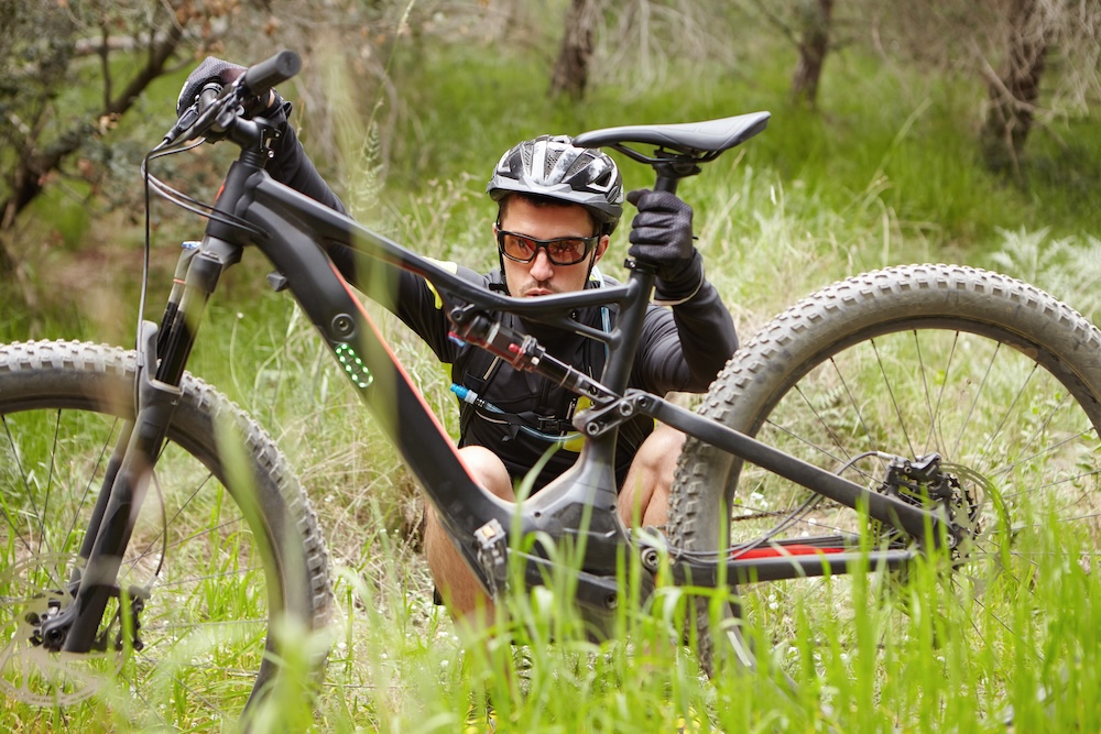 man sitting with his E-bike