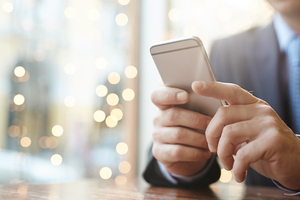 a man texting on a cell phone