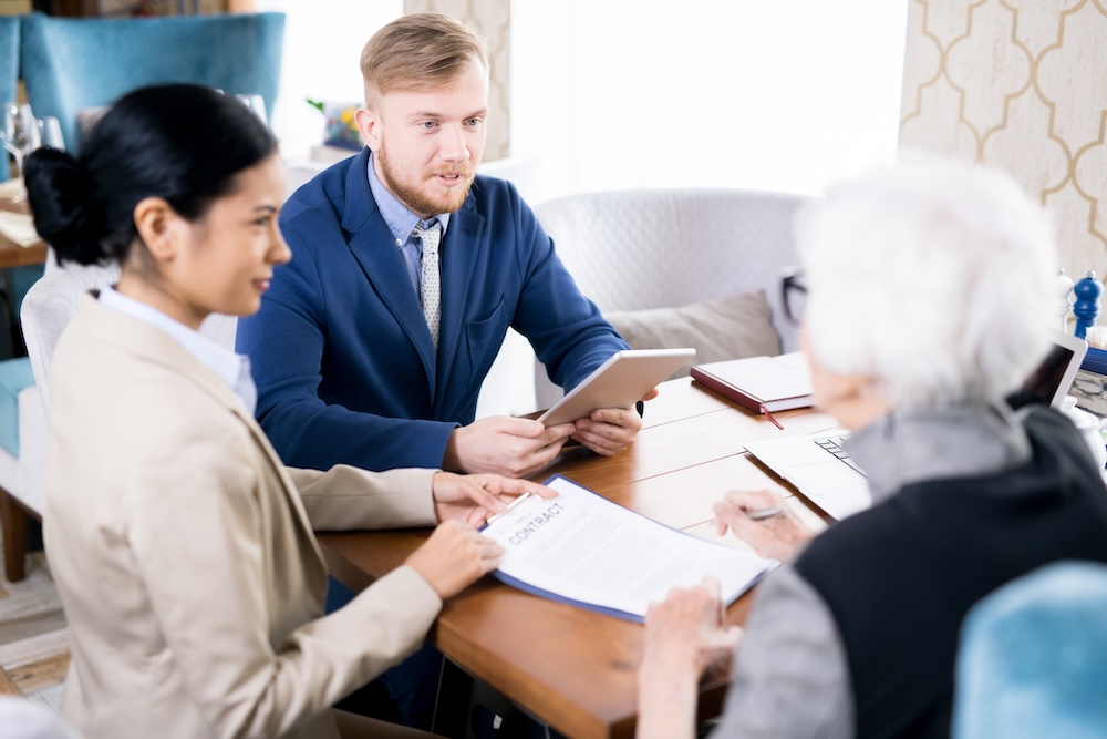 two people talking with an insurance agent