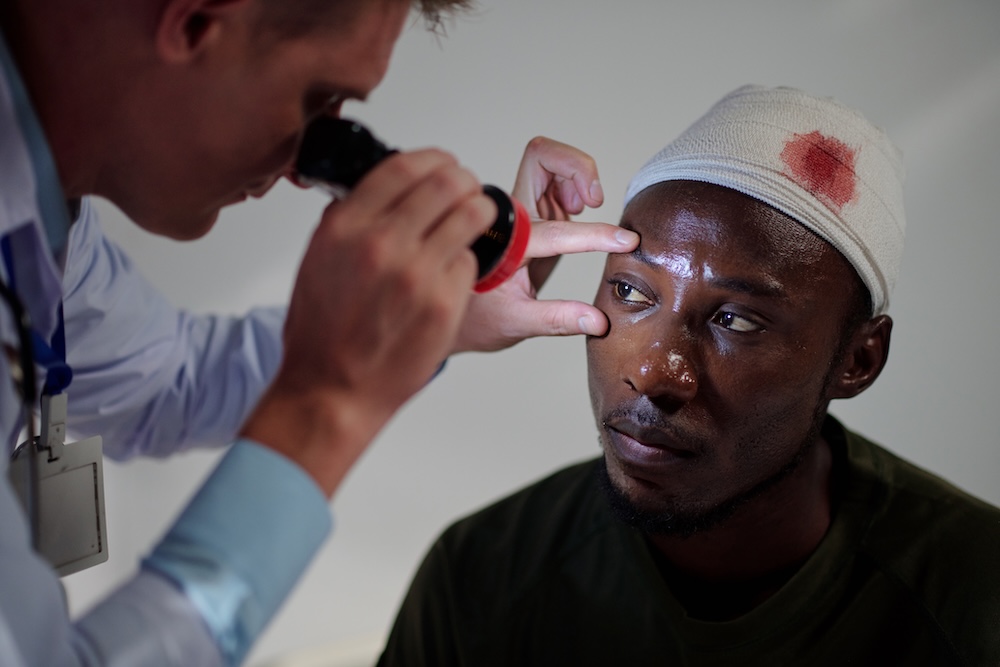 a man at the doctor with a head injury